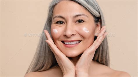 Closeup Of Caucasian Mature Middle Aged Shirtless Naked Woman Applying Closeup Of Caucasian Mature Middle Aged Shirtless Naked Woman Applying